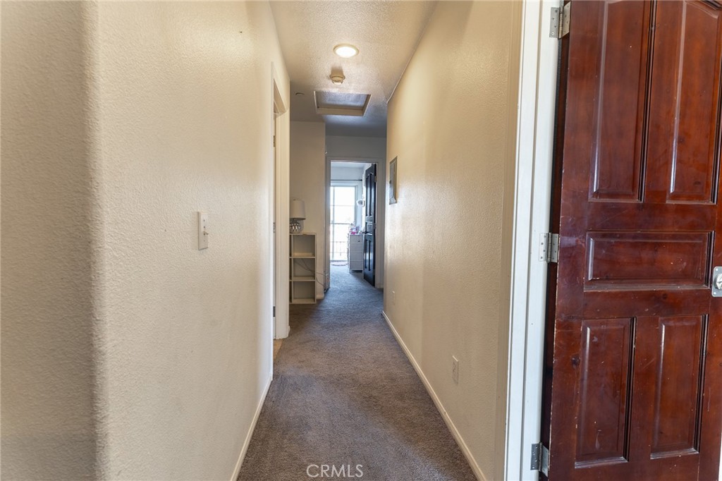 14176 Kiowa Road Apple Valley, CA 92307 - Photo 29 of 54 a view of a hallway with wooden floor