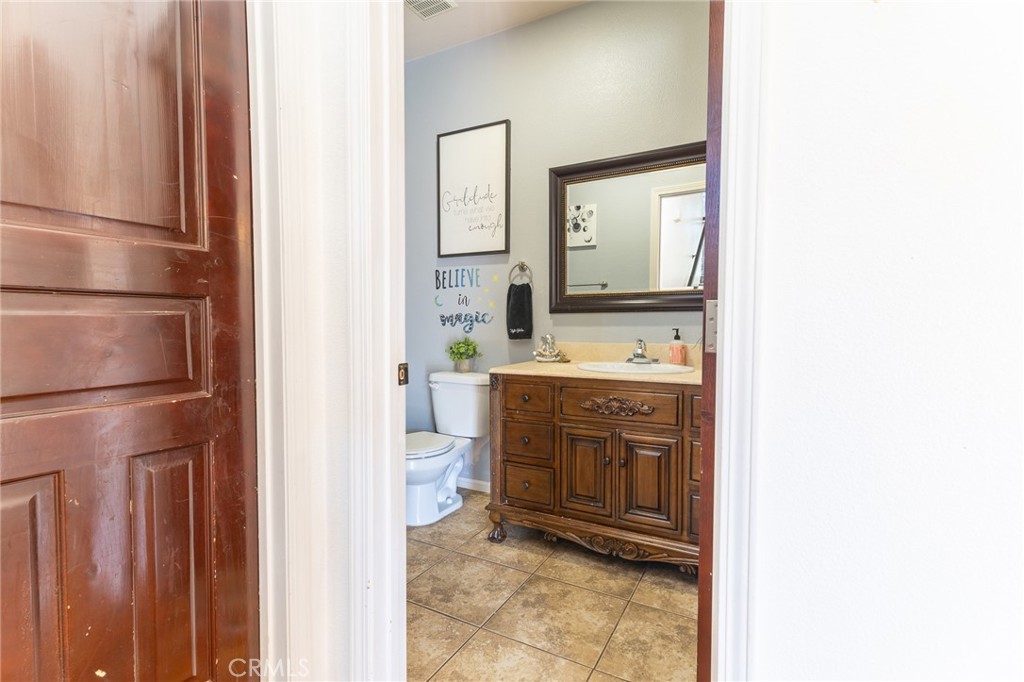 14176 Kiowa Road Apple Valley, CA 92307 - Photo 31 of 54 a bathroom with a sink and a mirror