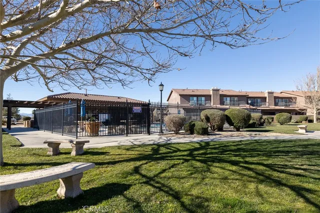 a kitchen with granite countertop a wooden cabinets and a sink