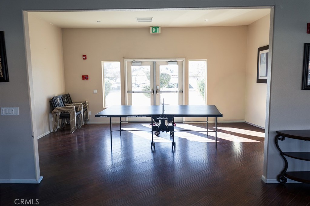 14176 Kiowa Road Apple Valley, CA 92307 - Photo 52 of 54 a room with furniture and wooden floor