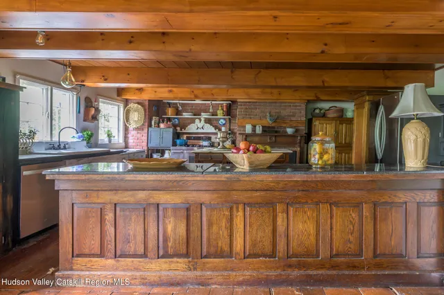 a kitchen with stainless steel appliances granite countertop a stove and a refrigerator