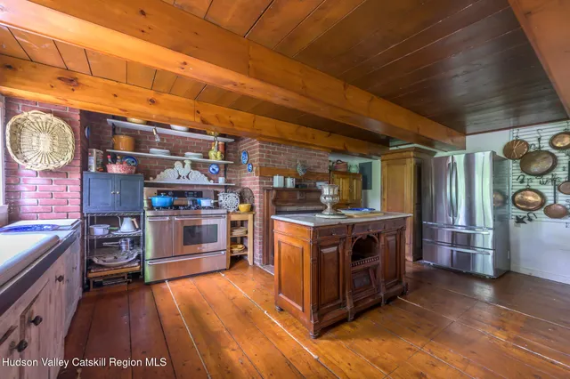 a view of living room with furniture and flowers