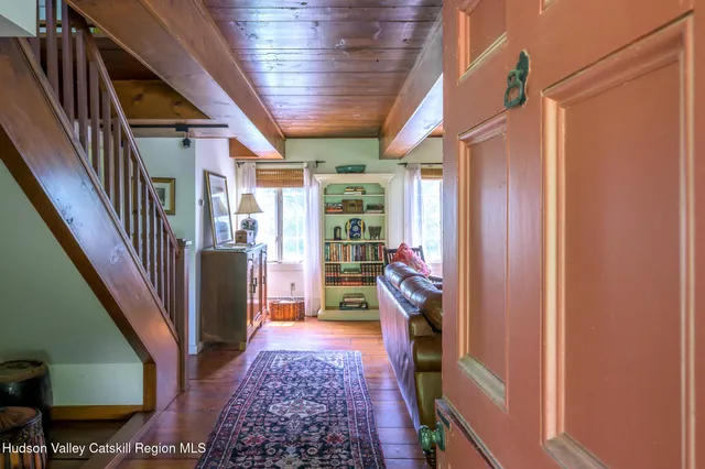 a living room with furniture or couch and a wooden floor