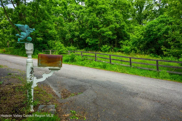 a view of a park with large trees