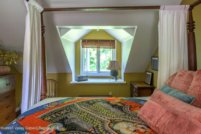 a bed room with a bed and a window