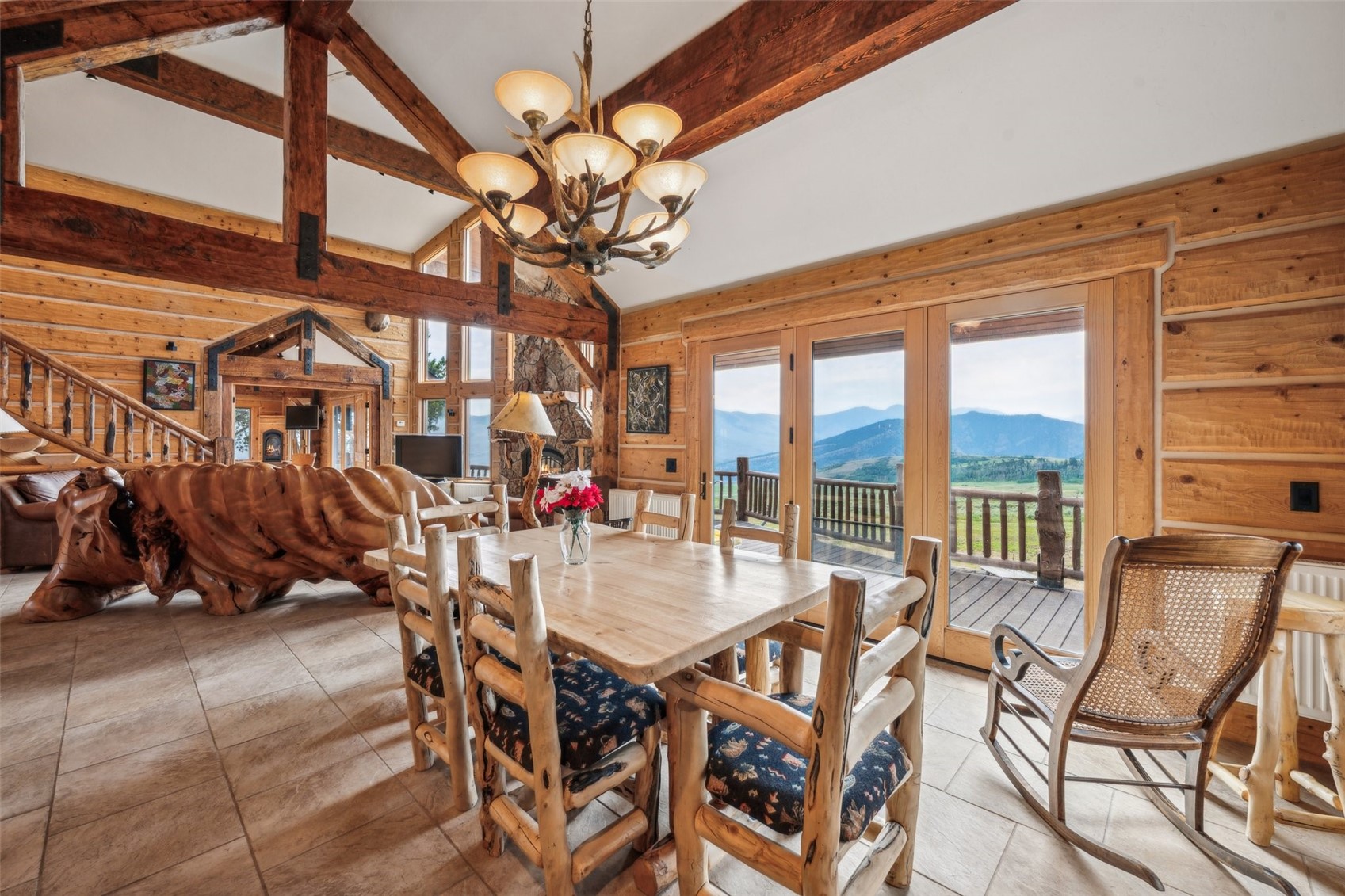 733 Spring Creek Ranch Road Silverthorne, CO 80498 - Photo 12 of 34 a view of a dining room with furniture window and outside view