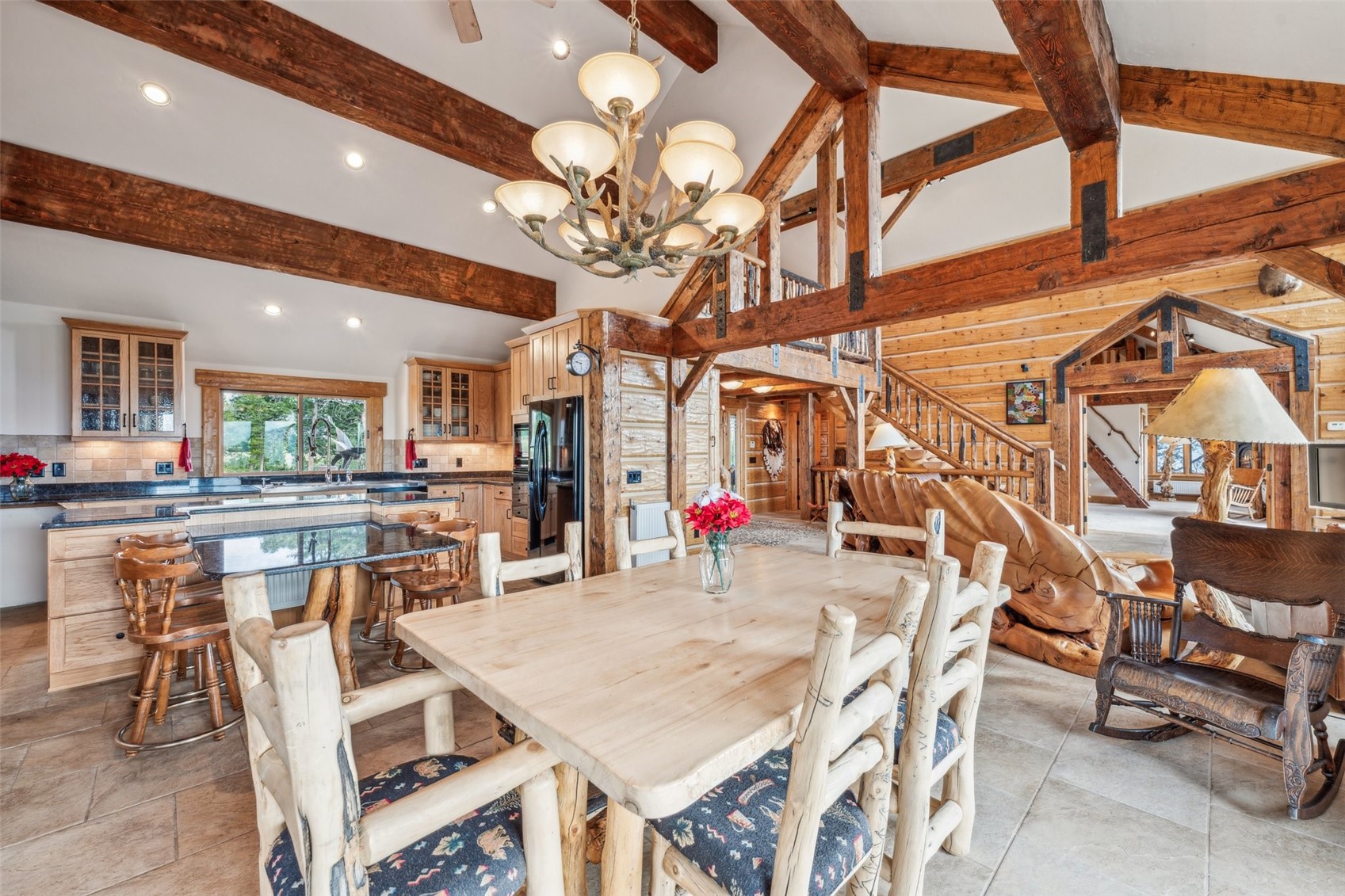 733 Spring Creek Ranch Road Silverthorne, CO 80498 - Photo 13 of 34 a view of a dining room with furniture and a chandelier