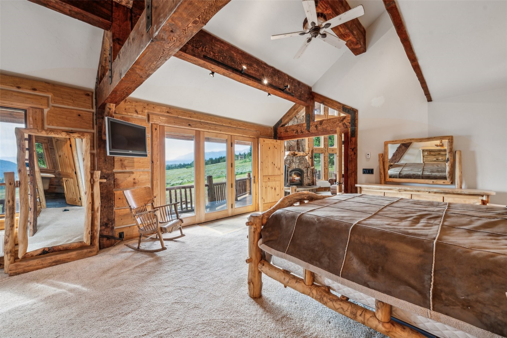 733 Spring Creek Ranch Road Silverthorne, CO 80498 - Photo 15 of 34 a bed room with bed and glass door