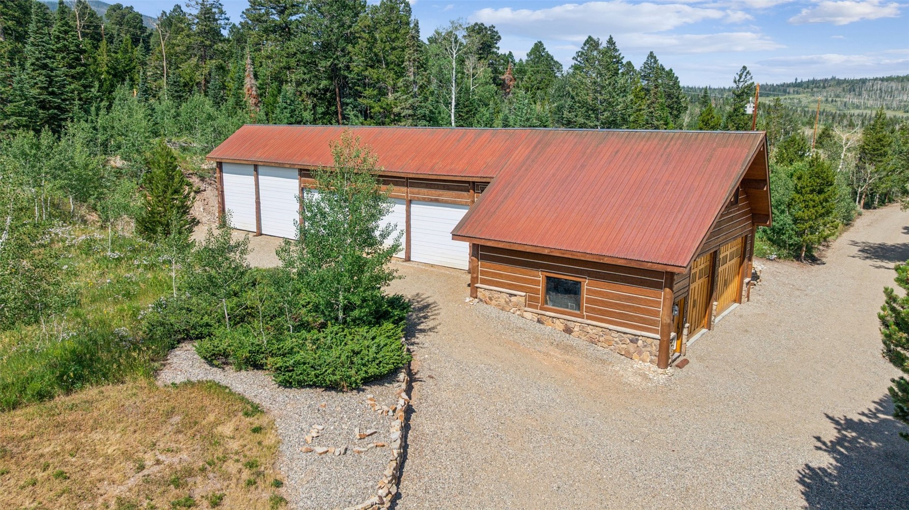 733 Spring Creek Ranch Road Silverthorne, CO 80498 - Photo 33 of 34 an aerial view of a house with swimming pool and trees