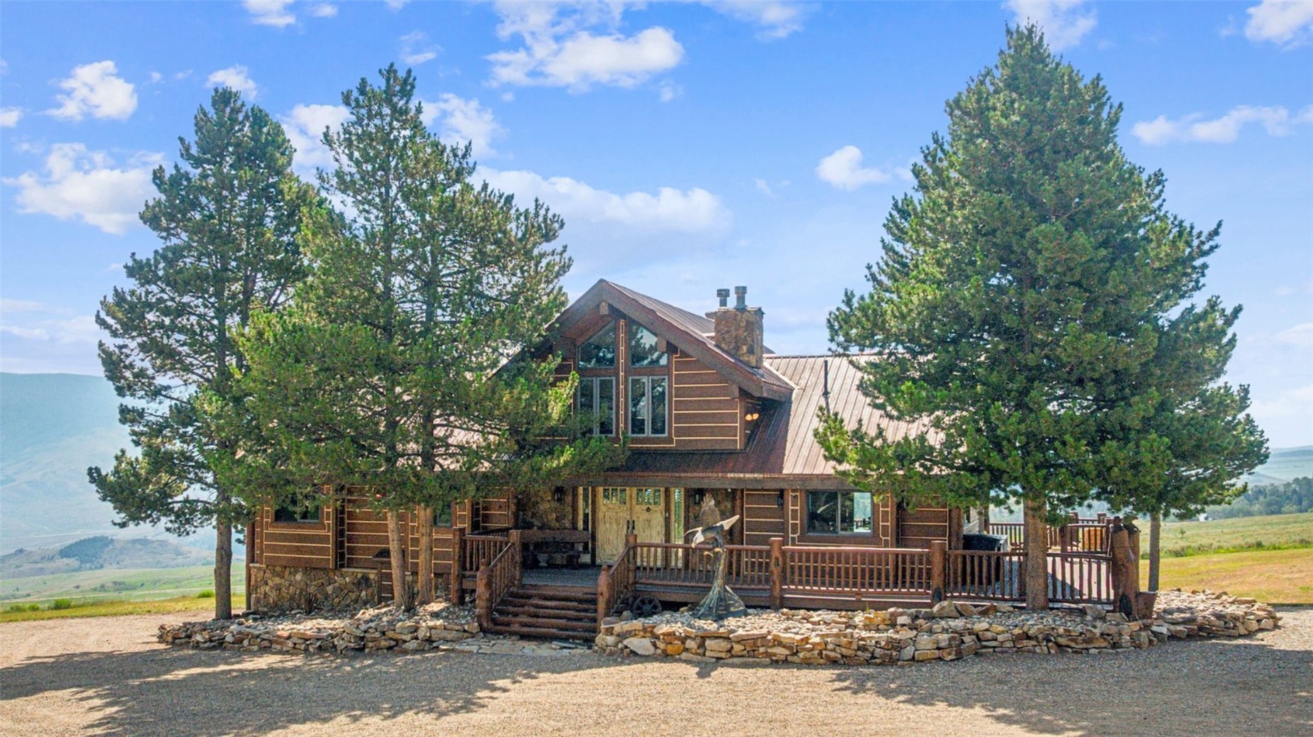 733 Spring Creek Ranch Road Silverthorne, CO 80498 - Photo 4 of 34 a front view of a house with a tree