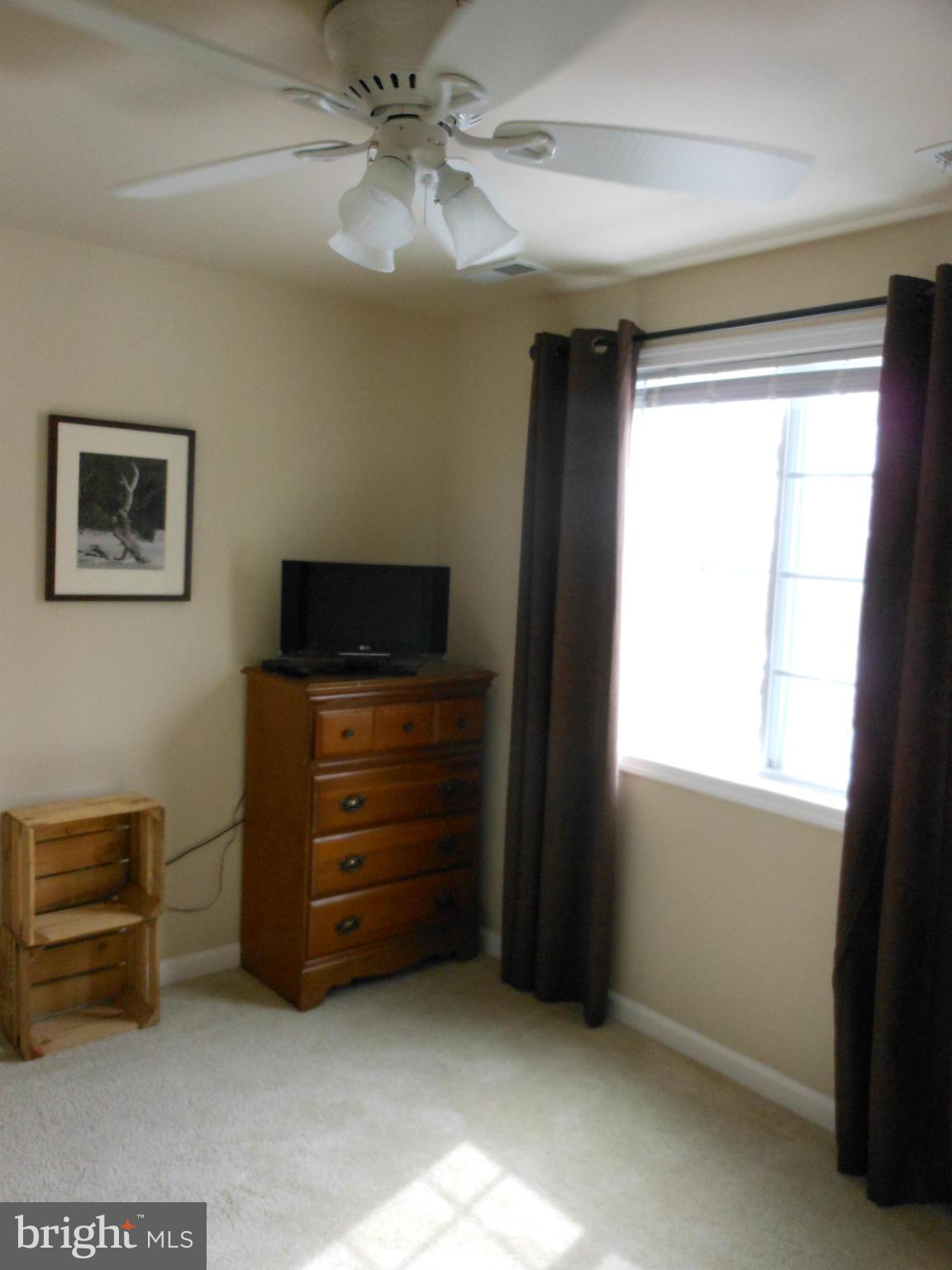 8503 Golden Ridge Court Lorton, VA 22079 - Photo 20 of 27 a room with furniture and a window