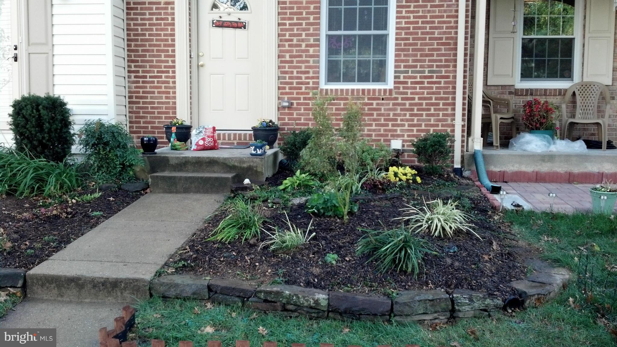 8503 Golden Ridge Court Lorton, VA 22079 - Photo 3 of 27 a view of a house with a backyard