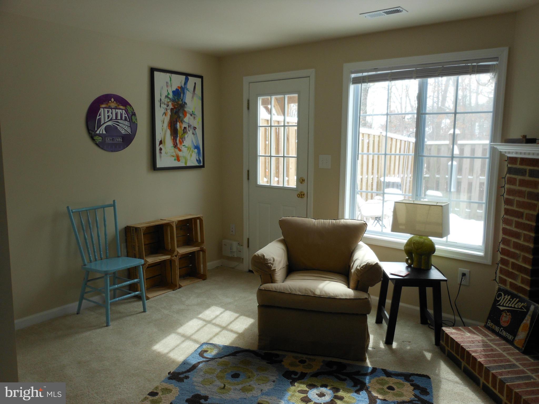 8503 Golden Ridge Court Lorton, VA 22079 - Photo 23 of 27 a living room with furniture and a window