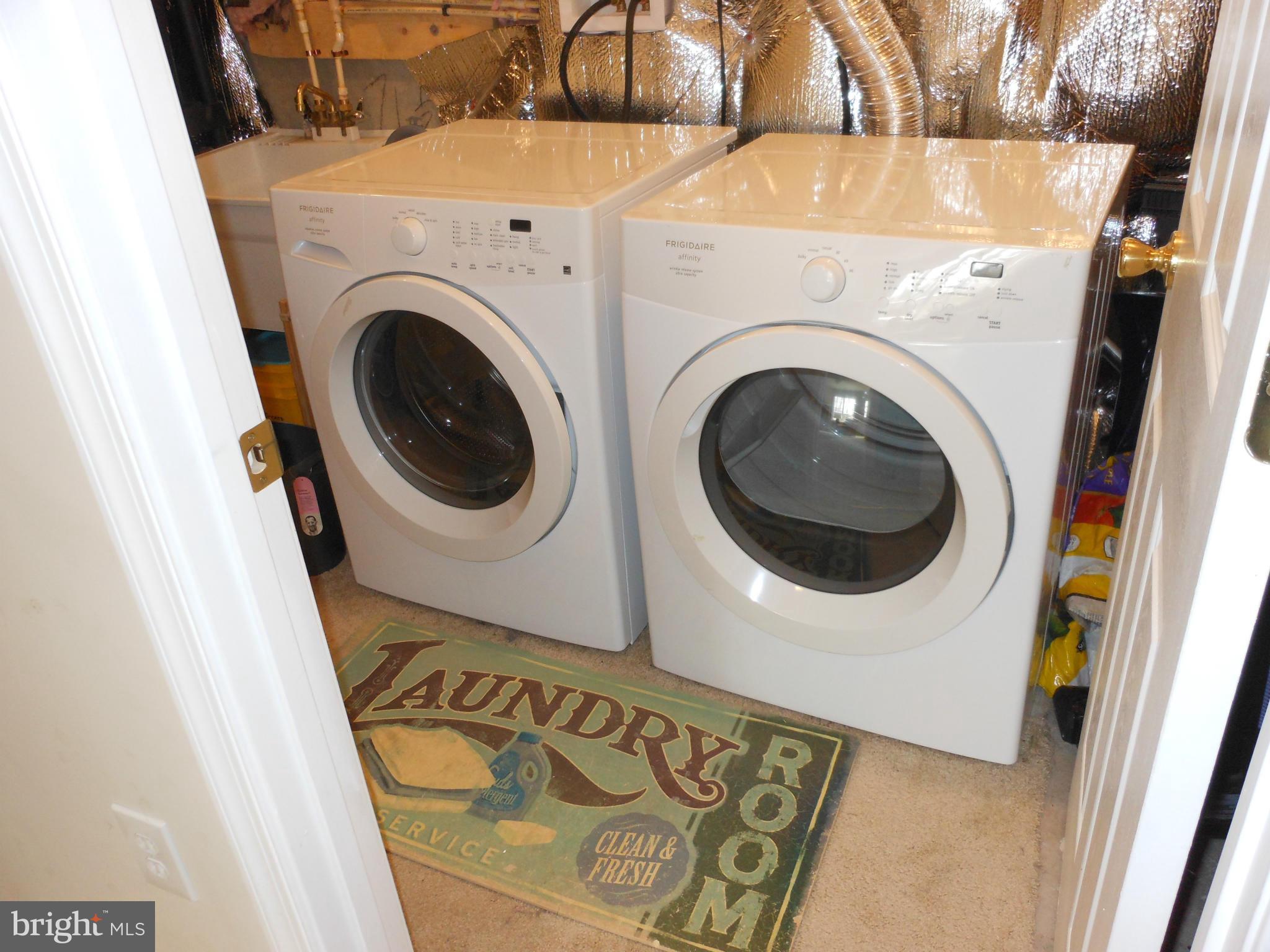 8503 Golden Ridge Court Lorton, VA 22079 - Photo 24 of 27 a utility room with dryer and washer