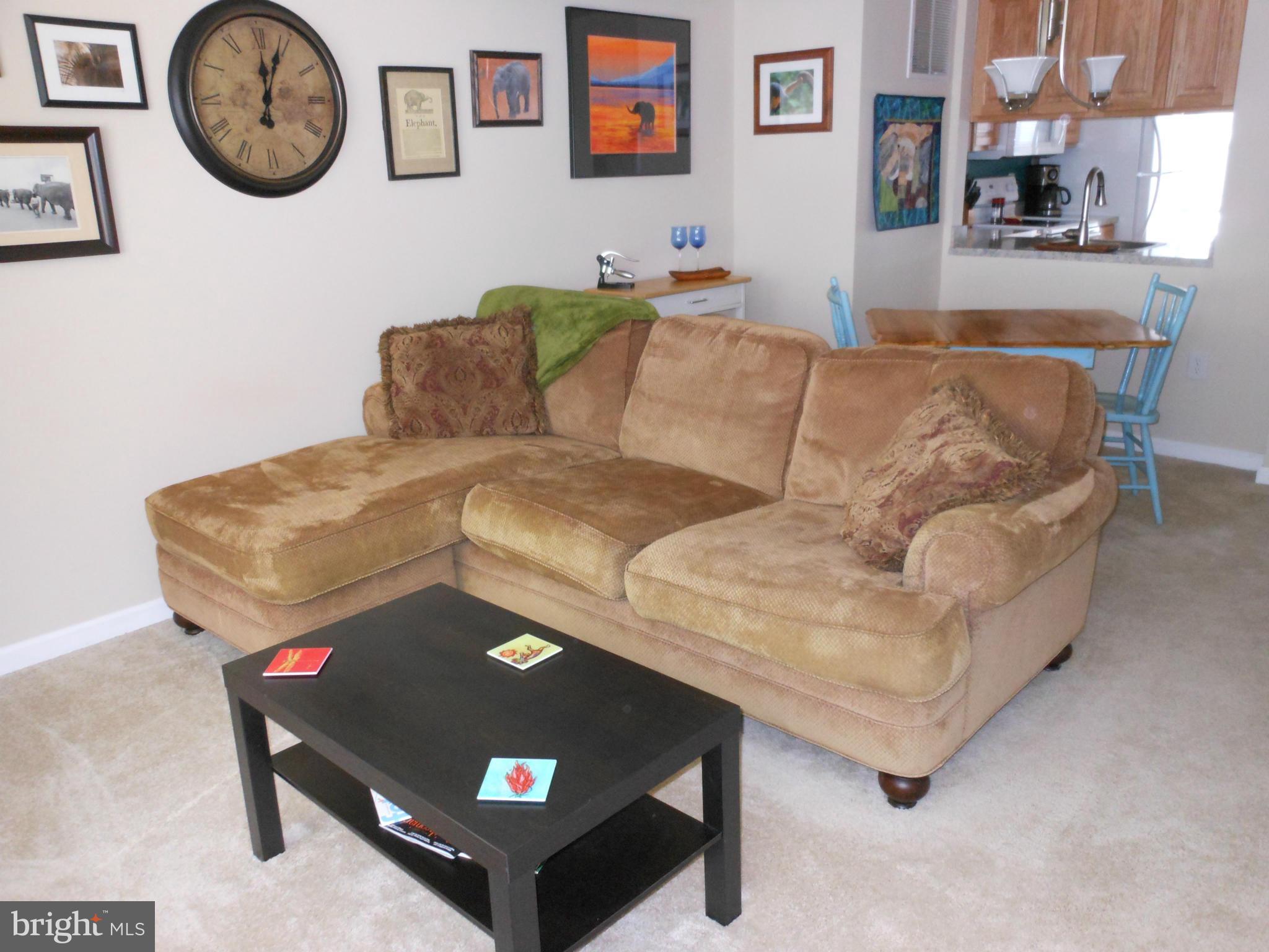 8503 Golden Ridge Court Lorton, VA 22079 - Photo 5 of 27 a living room with furniture and wall paintings