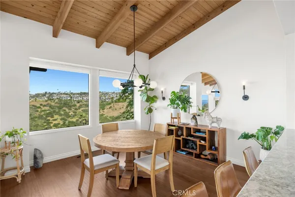 a view of a dining room with furniture window and outside view