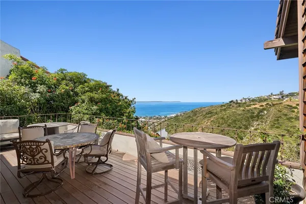 a view of a chairs and table on the terrace