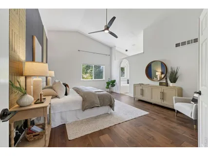a living room with furniture a rug and a large window