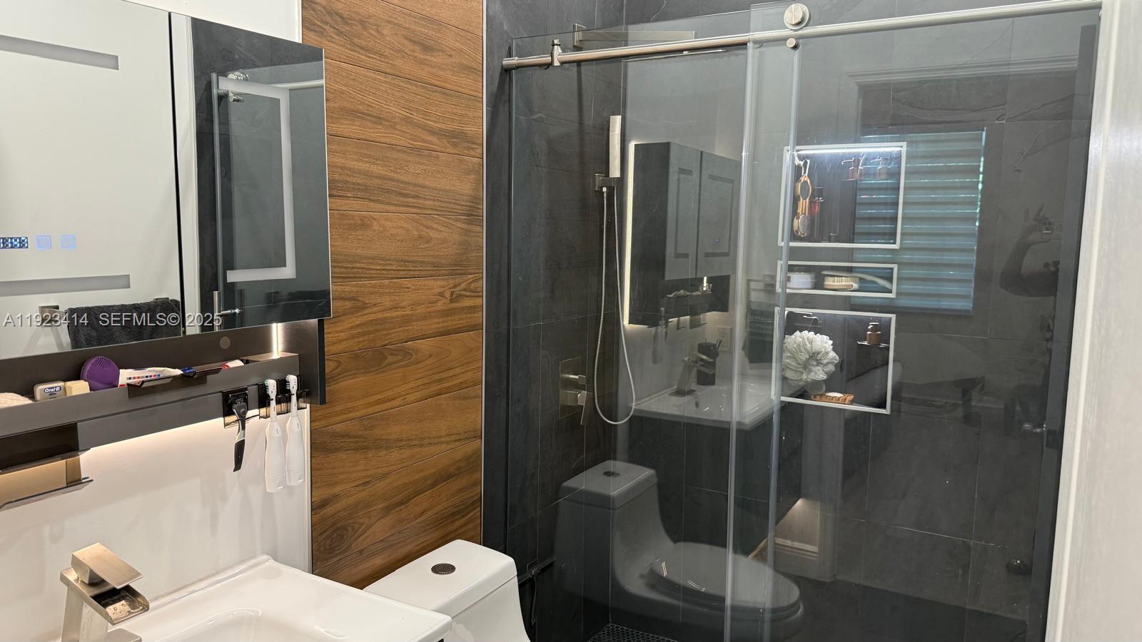 13839 Southwest 152nd Terrace Miami, FL 33177 - Photo 18 of 27 a bathroom with a shower and toilet