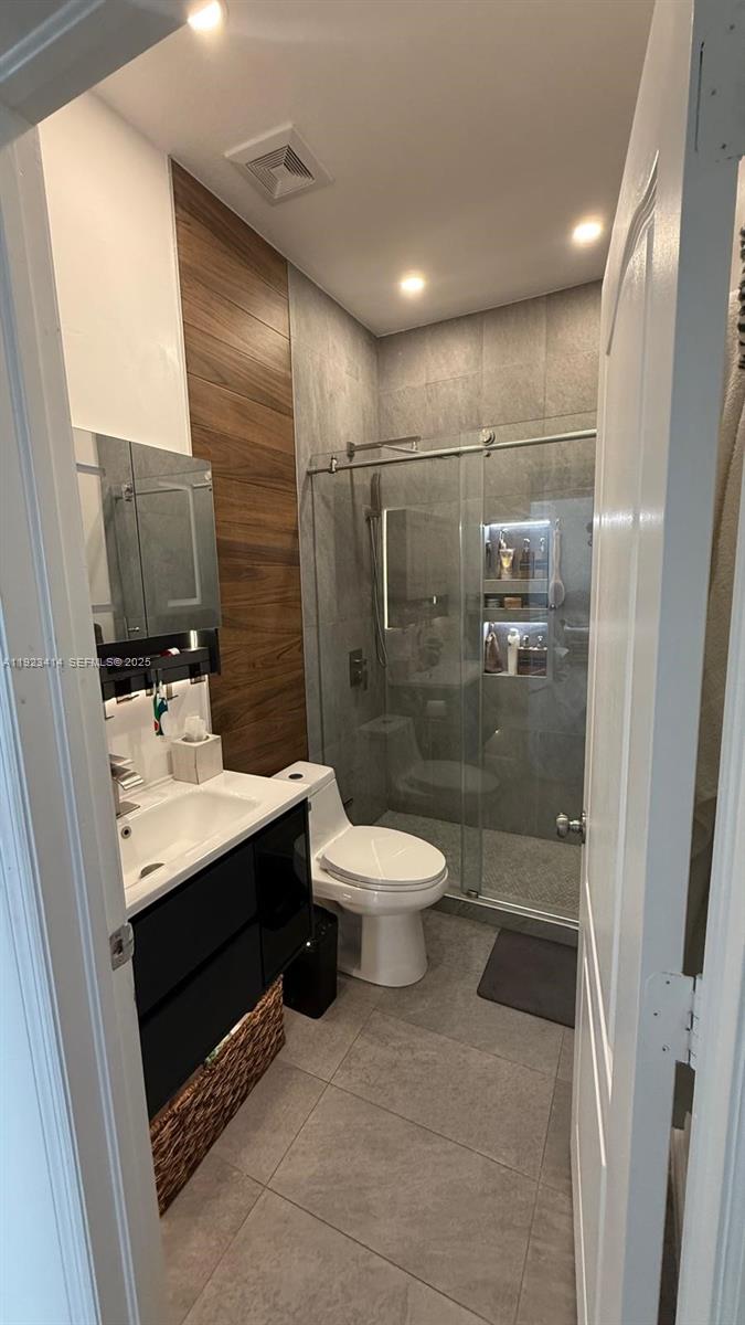 13839 Southwest 152nd Terrace Miami, FL 33177 - Photo 22 of 27 a bathroom with a sink toilet a mirror and shower