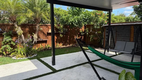 a view of a porch with a tree
