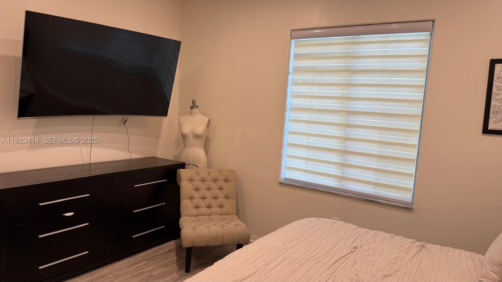 13839 Southwest 152nd Terrace Miami, FL 33177 - Photo 10 of 27 a bedroom with a bed and a television