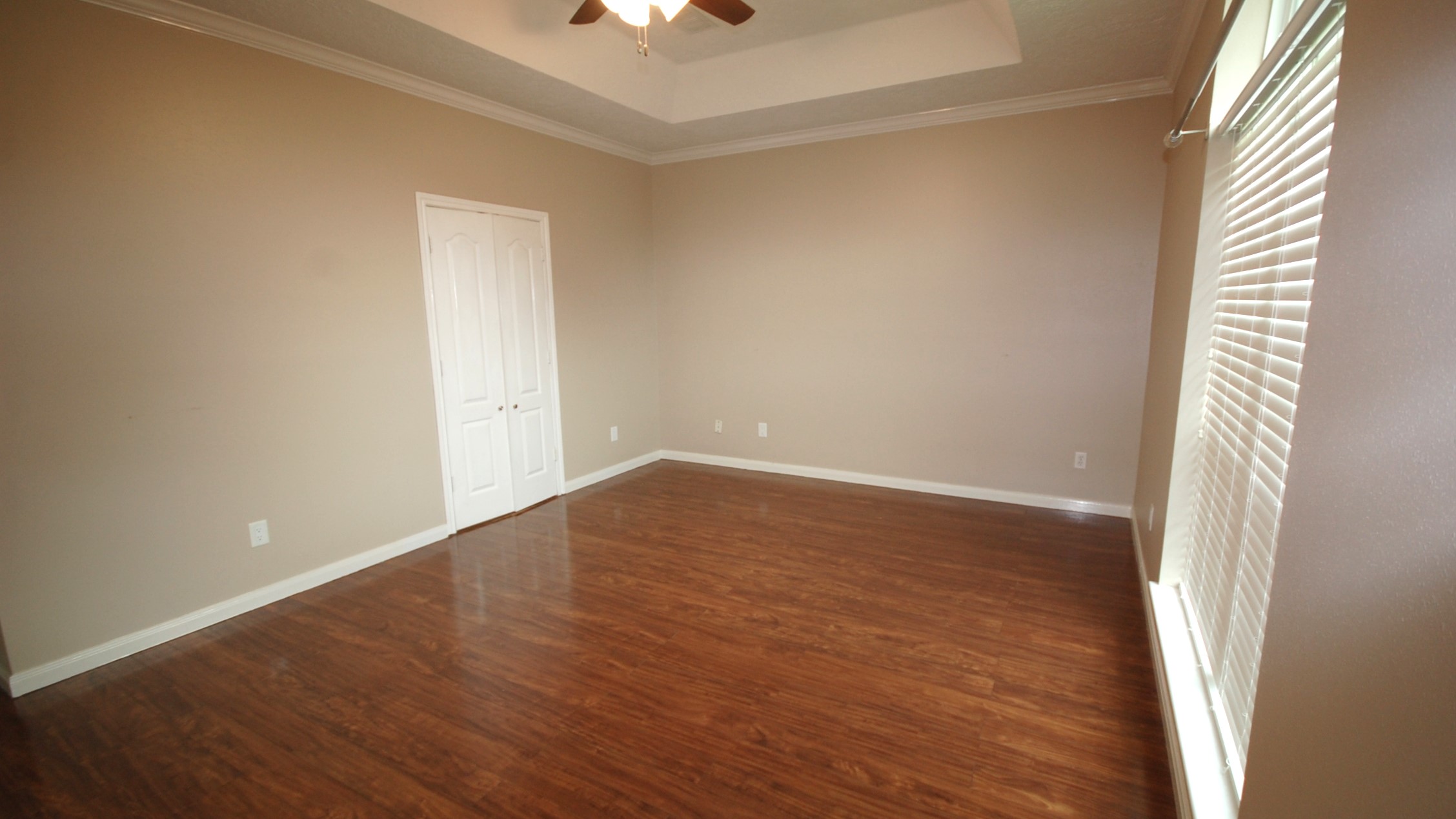 21818 Windsor Castle Drive Spring, TX 77388 - Photo 7 of 10 a view of an empty room with wooden floor and a window