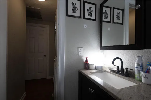 a kitchen with stainless steel appliances a sink and a refrigerator