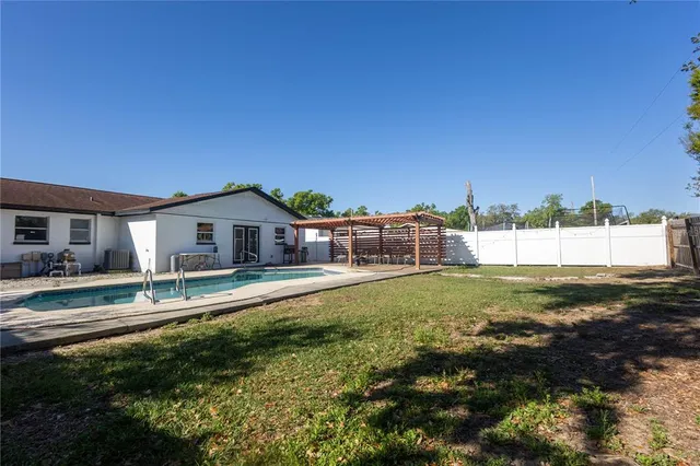 a house view with a sitting space and garden space