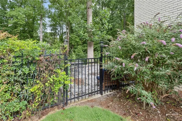 a view of a backyard with sitting area