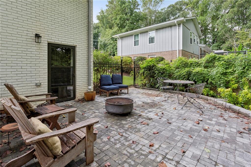 720 Brookline Drive Southeast Marietta, GA 30067 - Photo 13 of 15 a backyard of a house with fire pit and outdoor seating