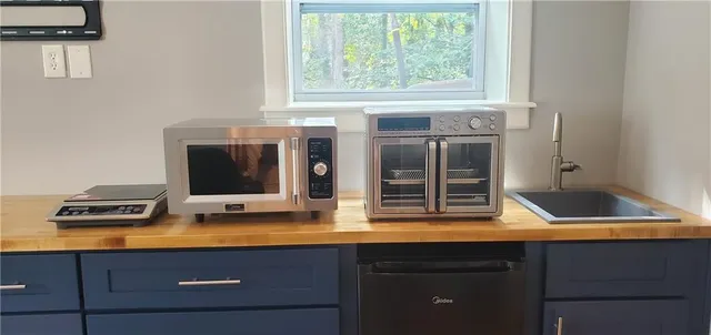 a bedroom with a bed and a desk