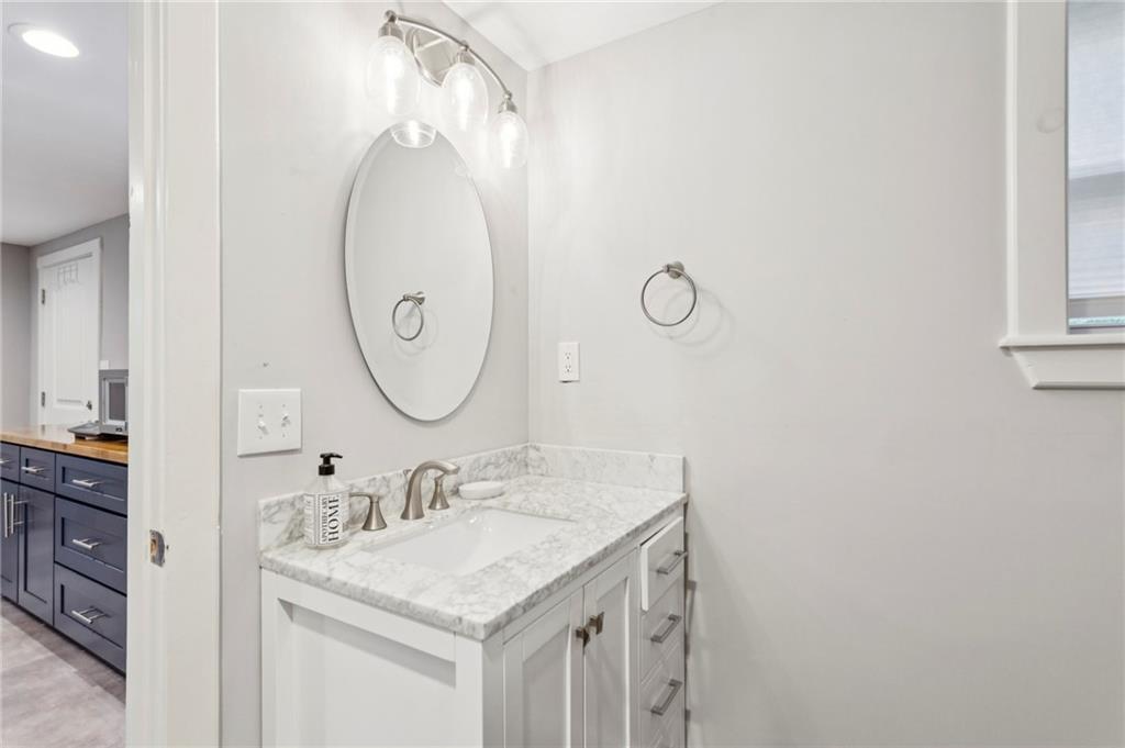 720 Brookline Drive Southeast Marietta, GA 30067 - Photo 9 of 15 a bathroom with a sink and a mirror
