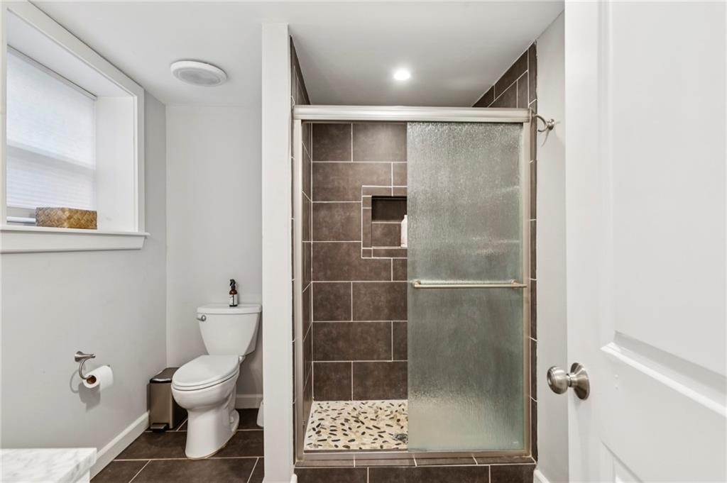 720 Brookline Drive Southeast Marietta, GA 30067 - Photo 10 of 15 a bathroom with a toilet and a shower