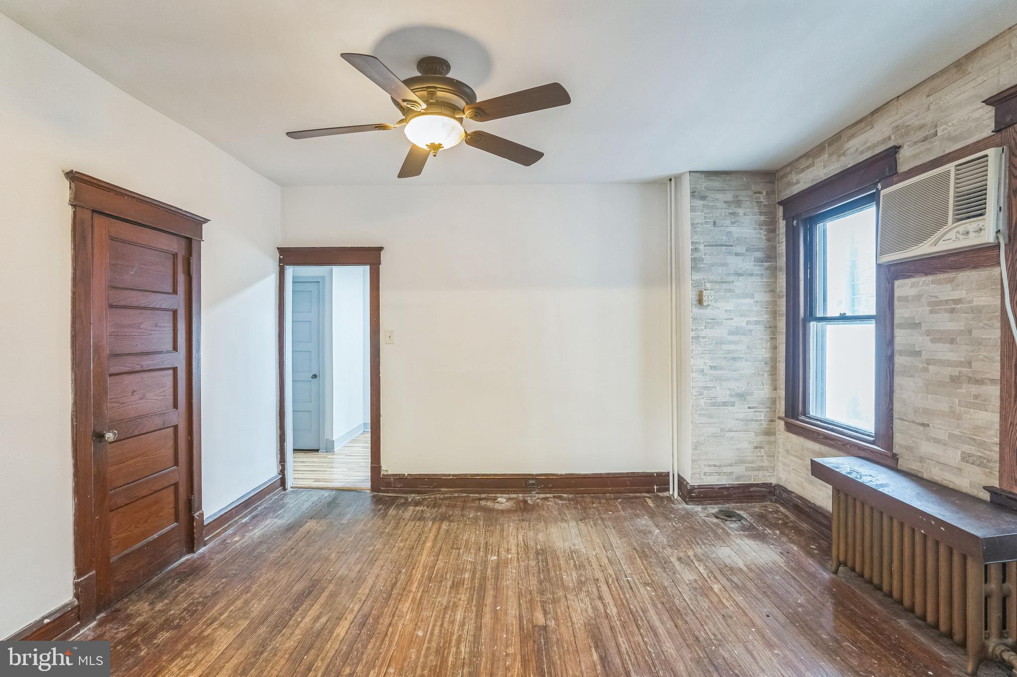 4420 Rhawn Street Philadelphia, PA 19136 - Photo 11 of 30 an empty room with wooden floor fan and windows