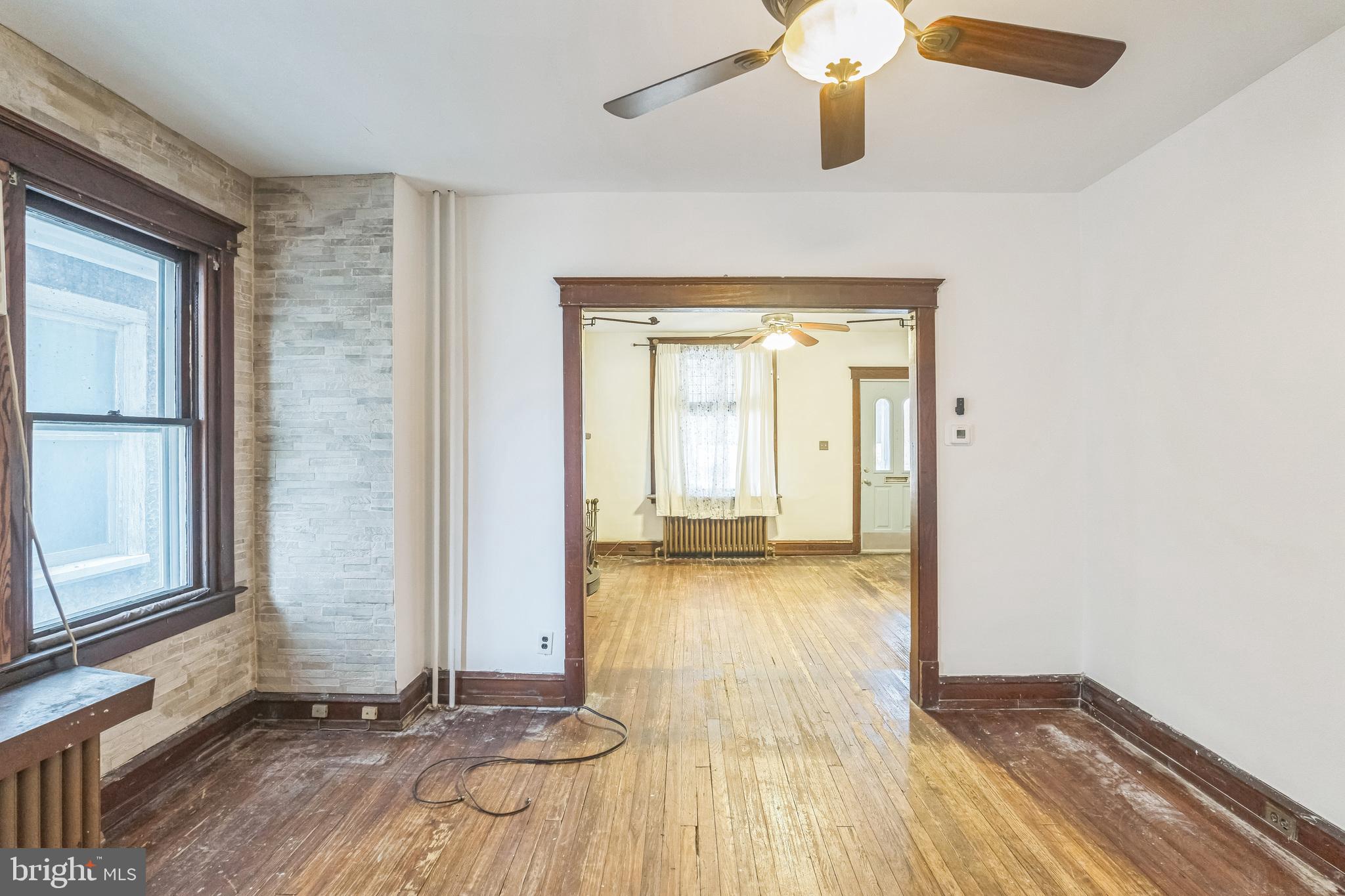4420 Rhawn Street Philadelphia, PA 19136 - Photo 12 of 30 a view of a room with wooden floor and door