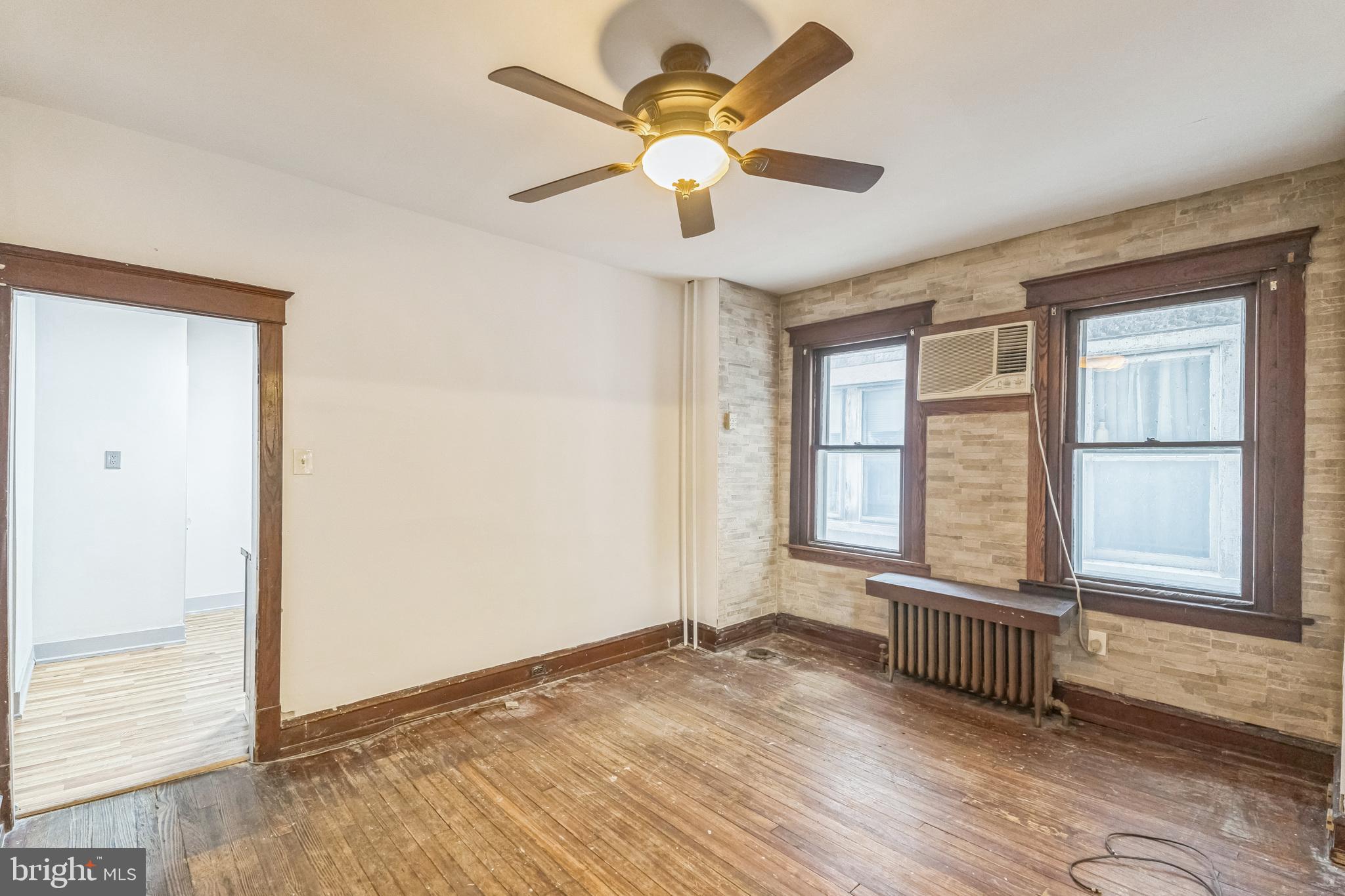 4420 Rhawn Street Philadelphia, PA 19136 - Photo 13 of 30 an empty room with wooden floor and windows