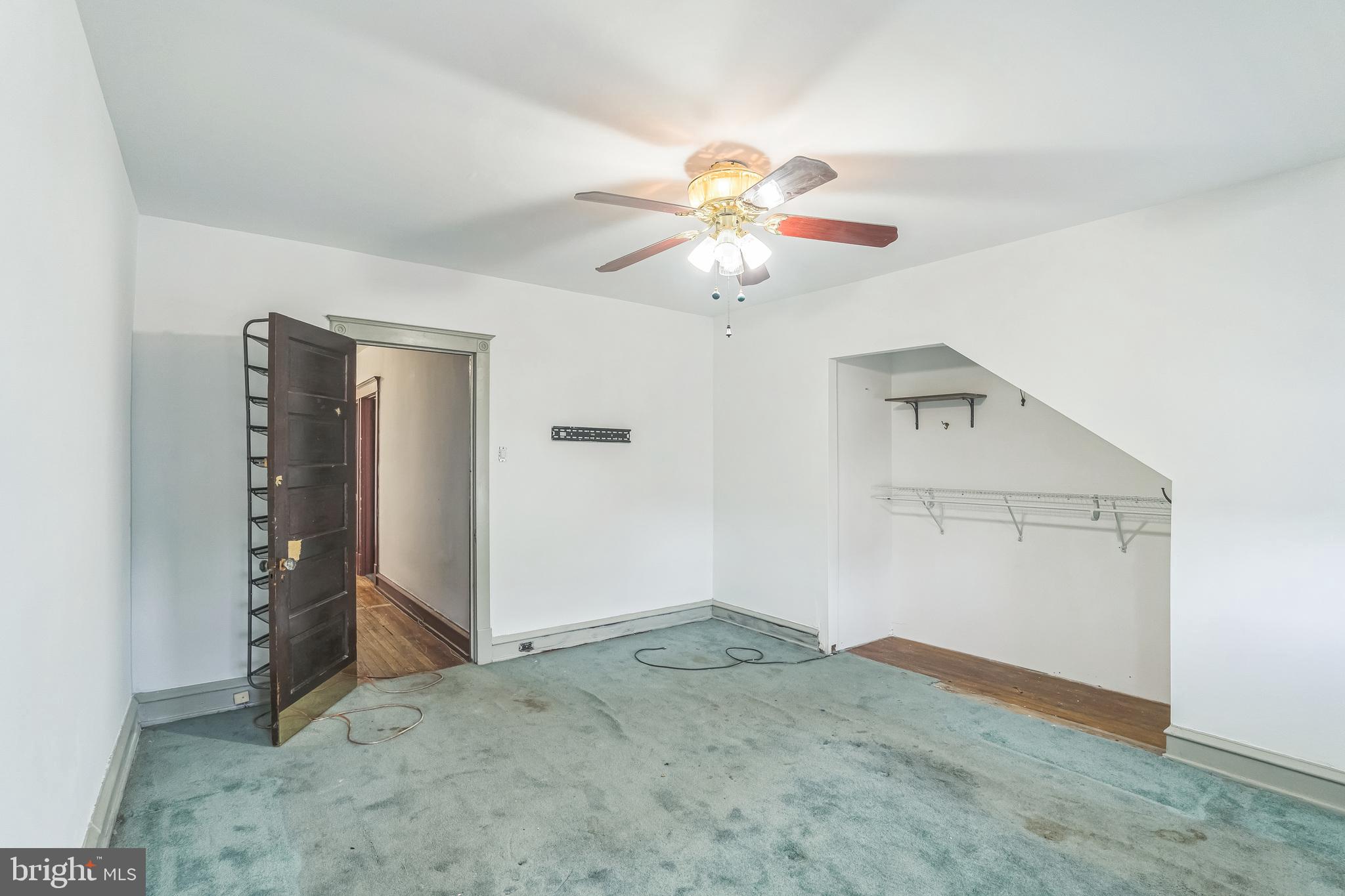 4420 Rhawn Street Philadelphia, PA 19136 - Photo 19 of 30 an empty room with closet and ceiling fan