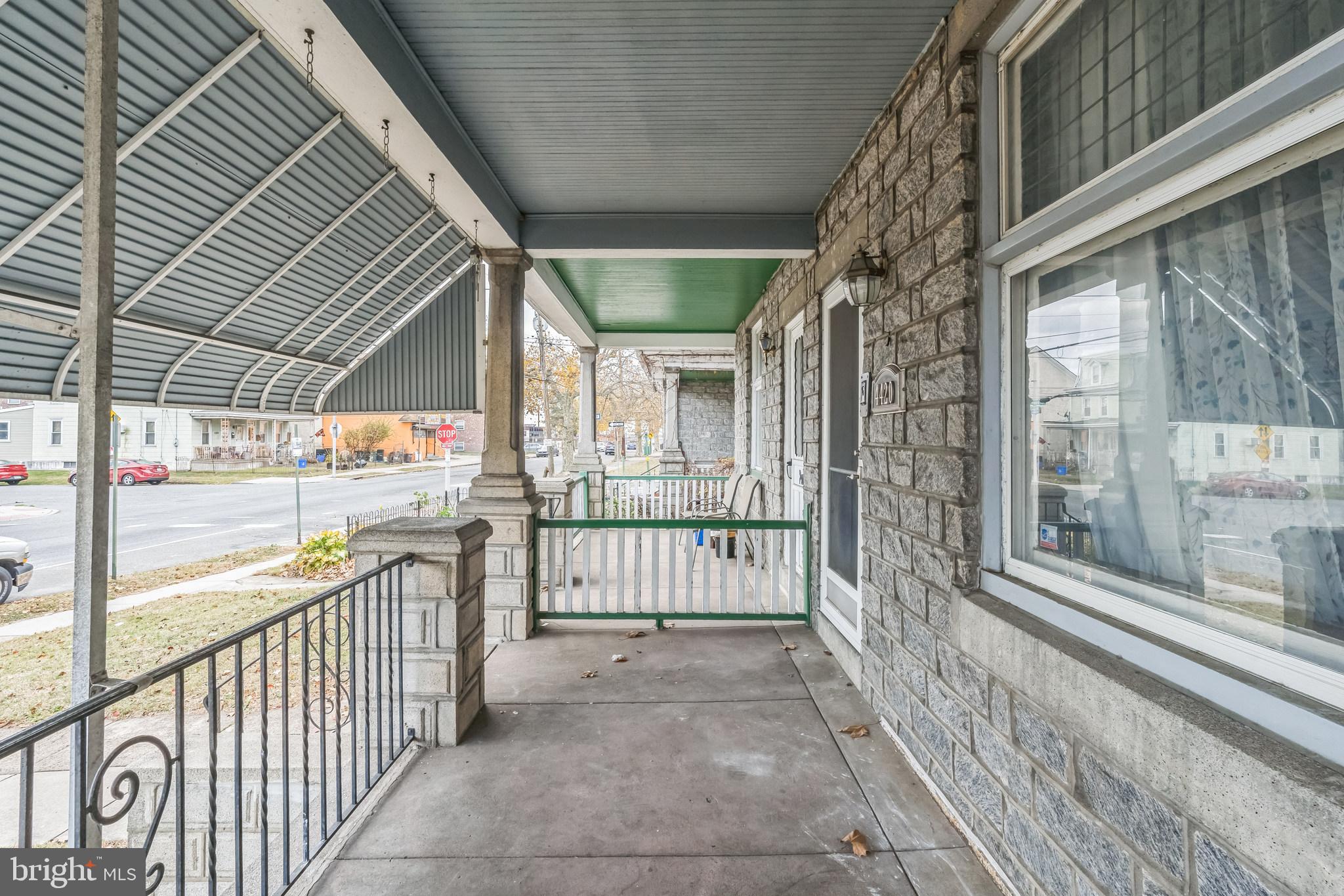 4420 Rhawn Street Philadelphia, PA 19136 - Photo 2 of 30 a view of a porch with wooden floor and gate
