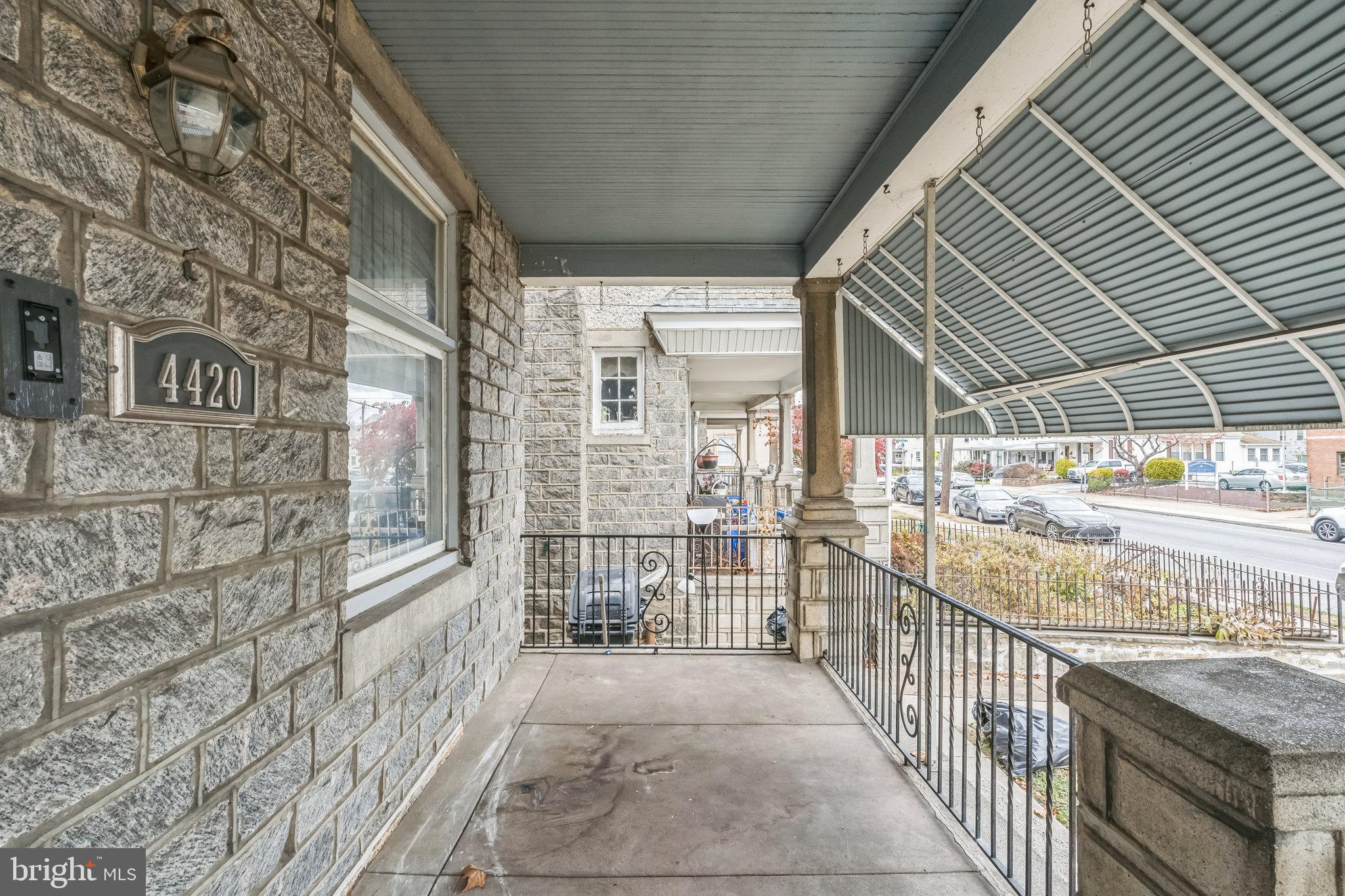 4420 Rhawn Street Philadelphia, PA 19136 - Photo 3 of 30 a view of a porch with wooden floor and fence