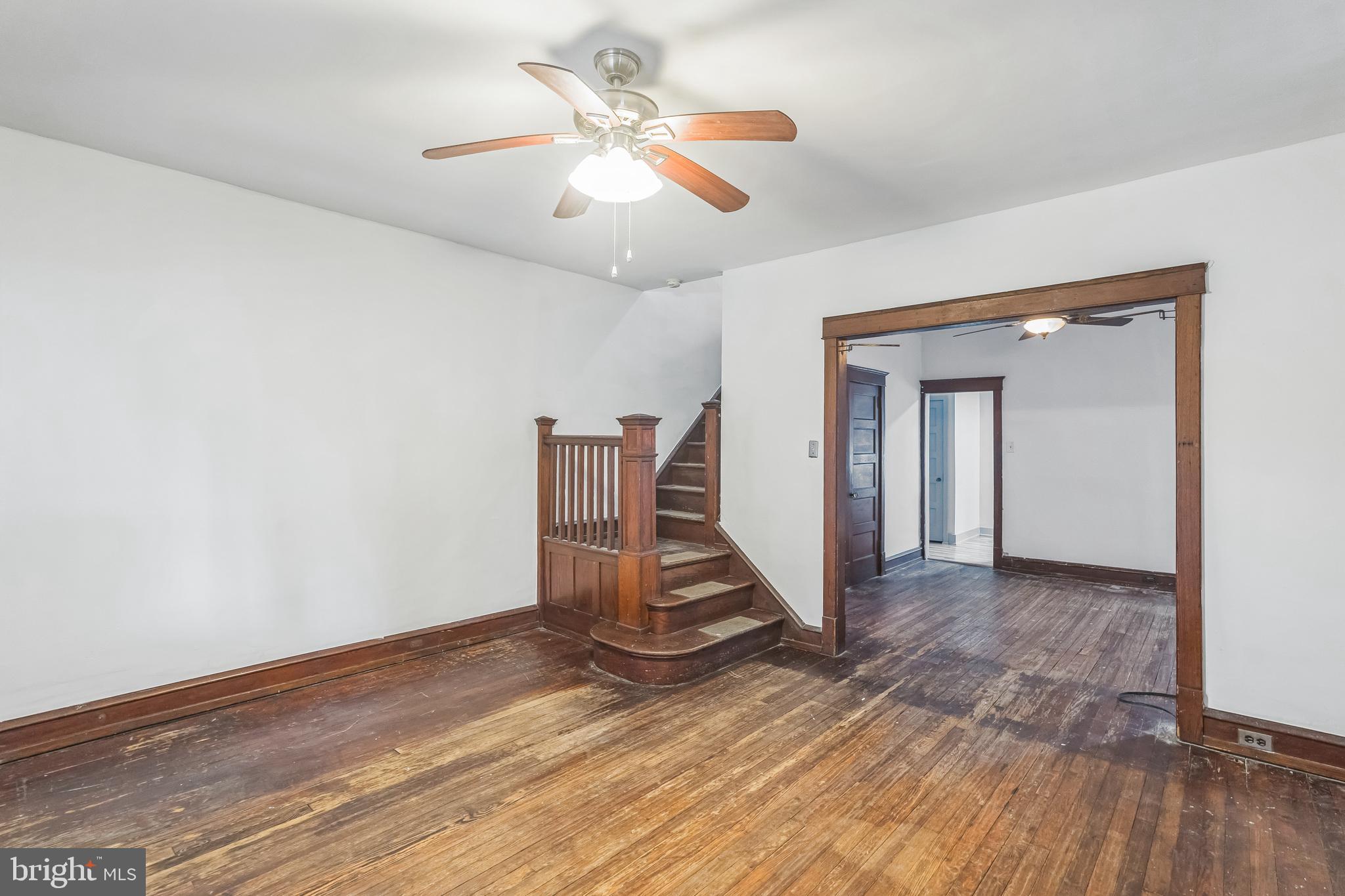 4420 Rhawn Street Philadelphia, PA 19136 - Photo 5 of 30 a view of an empty room with wooden floor and a ceiling fan