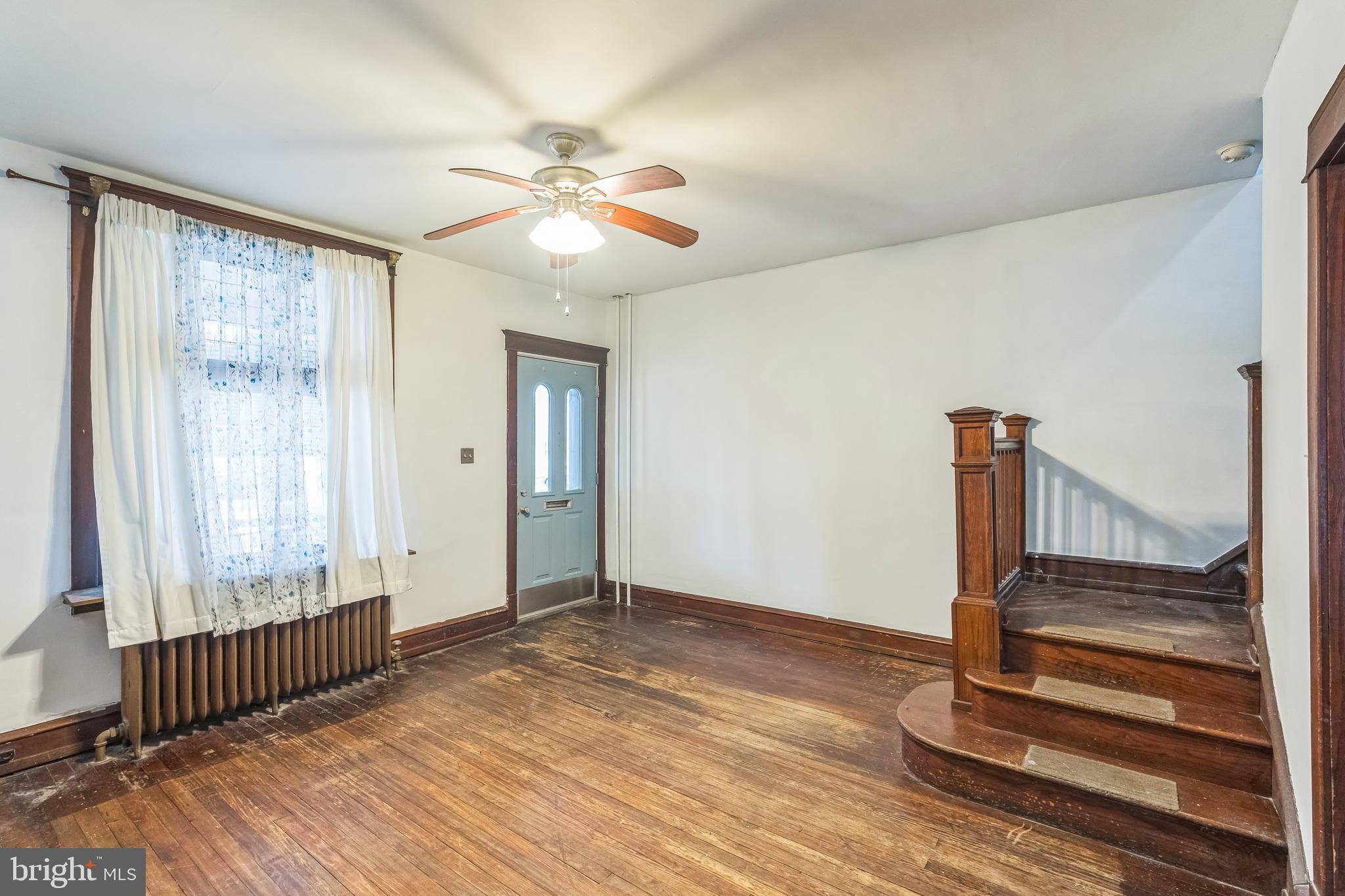 4420 Rhawn Street Philadelphia, PA 19136 - Photo 6 of 30 a view of an empty room with wooden floor and fan