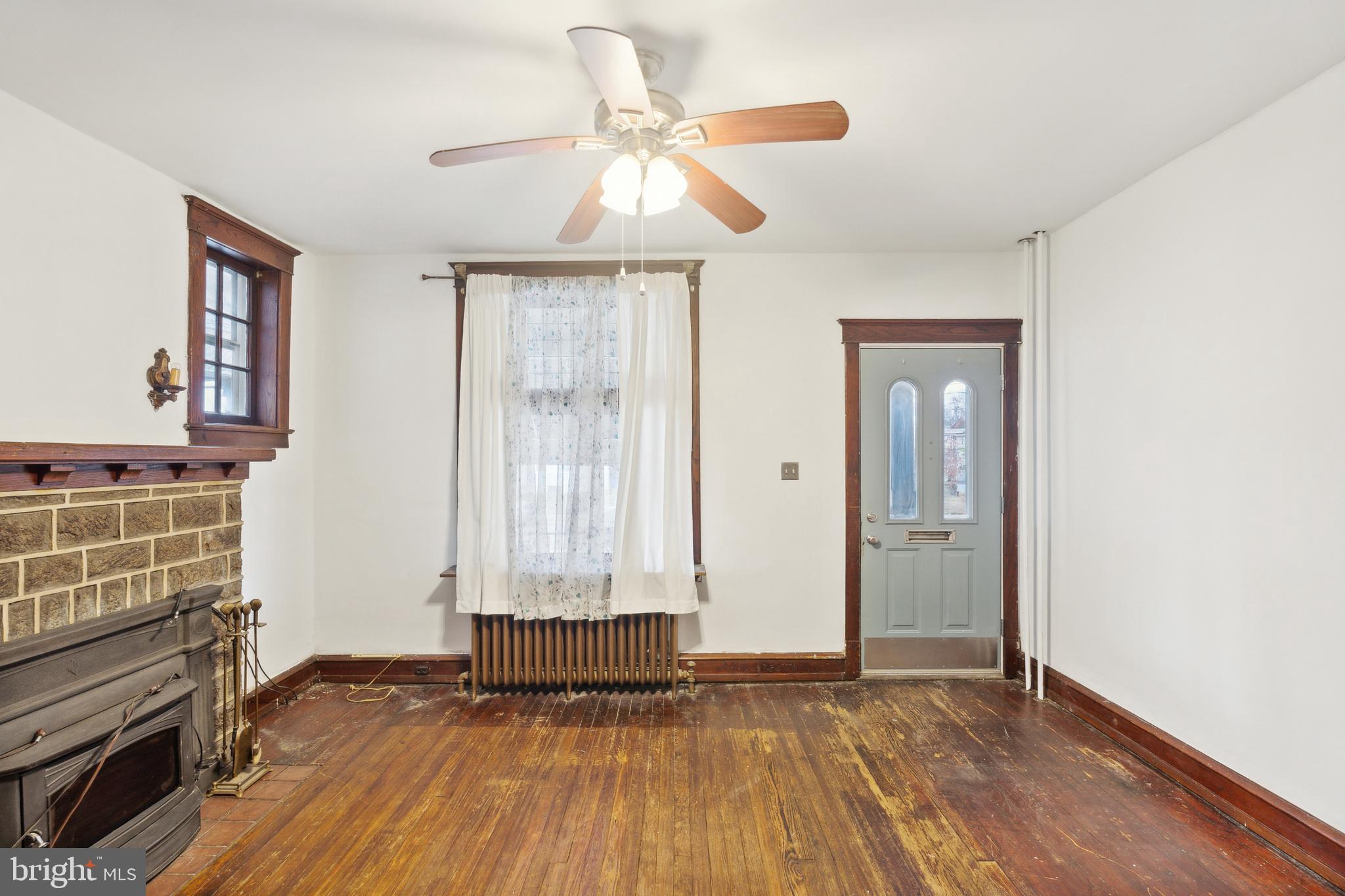 4420 Rhawn Street Philadelphia, PA 19136 - Photo 8 of 30 a view of empty room with wooden floor and fan