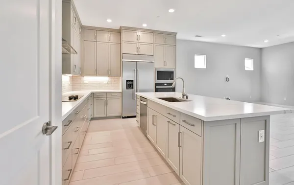 a kitchen with a sink and cabinets