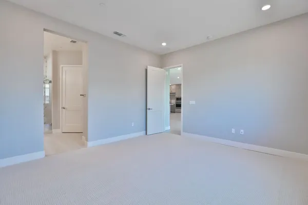 a bathroom with a double vanity sink mirror and shower
