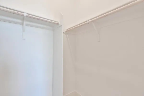 a kitchen with white cabinets and a sink