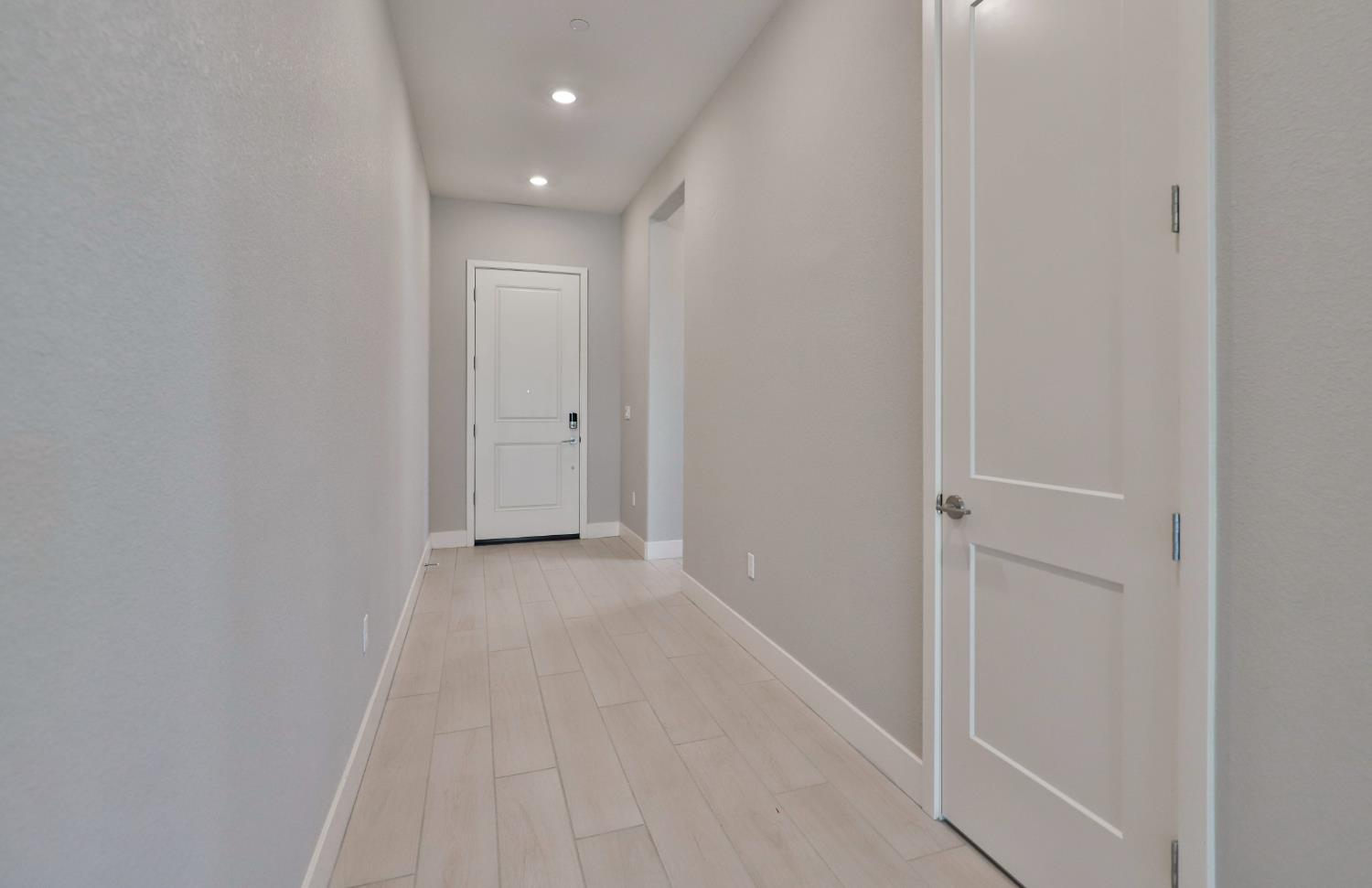 4788 Starglow Drive Penryn, CA 95663 - Photo 4 of 36 a view of a hallway with wooden floor