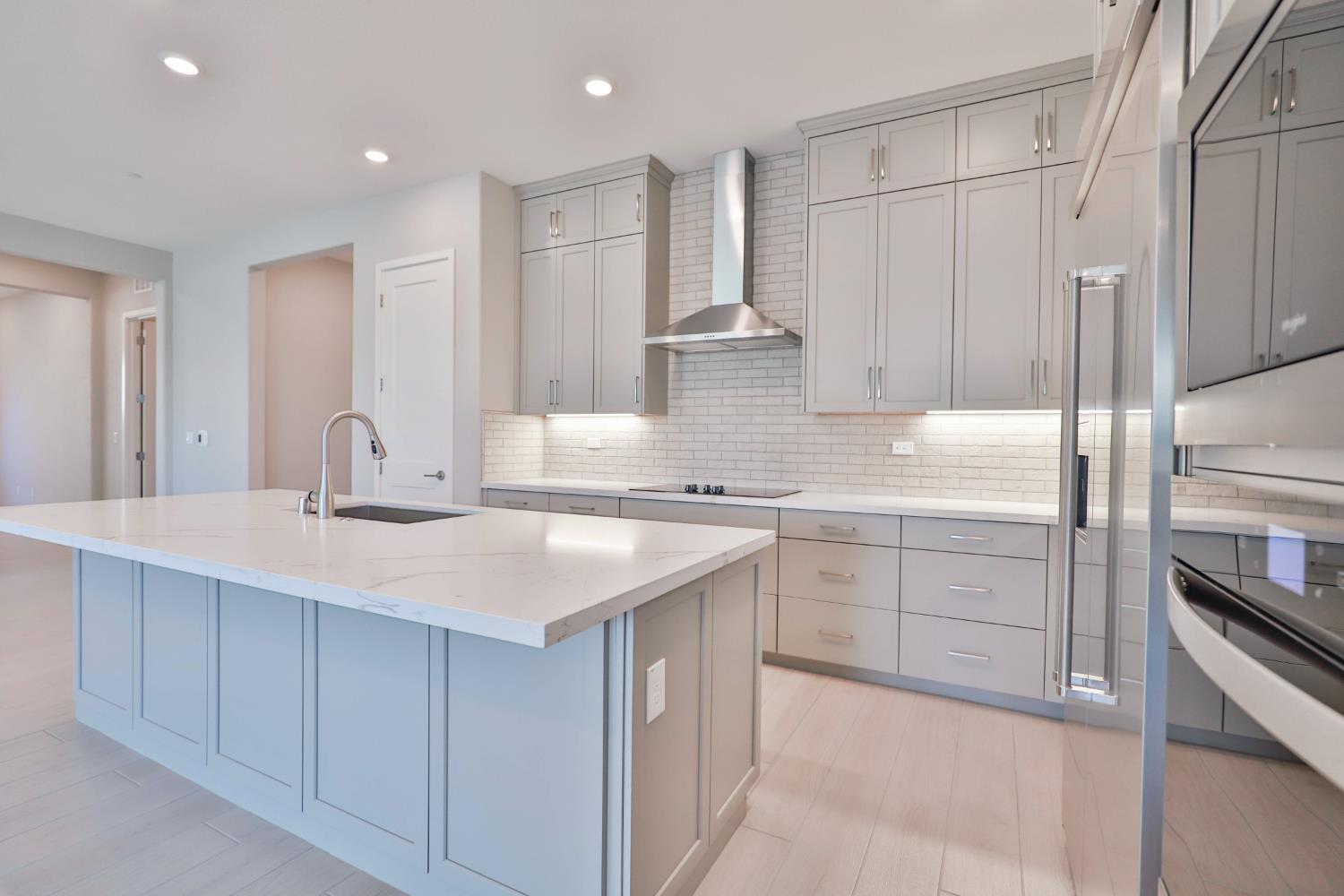 4788 Starglow Drive Penryn, CA 95663 - Photo 9 of 36 a kitchen with a sink stove and cabinets