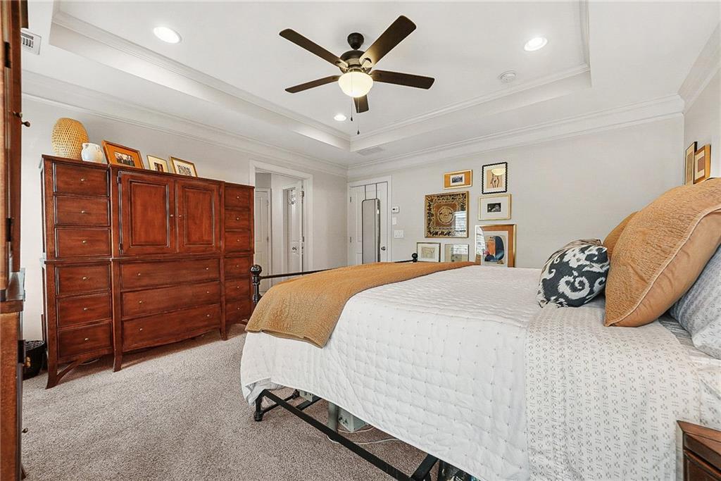 3715 Benton Lane Chamblee, GA 30341 - Photo 19 of 43 a bedroom with a bed and a ceiling fan