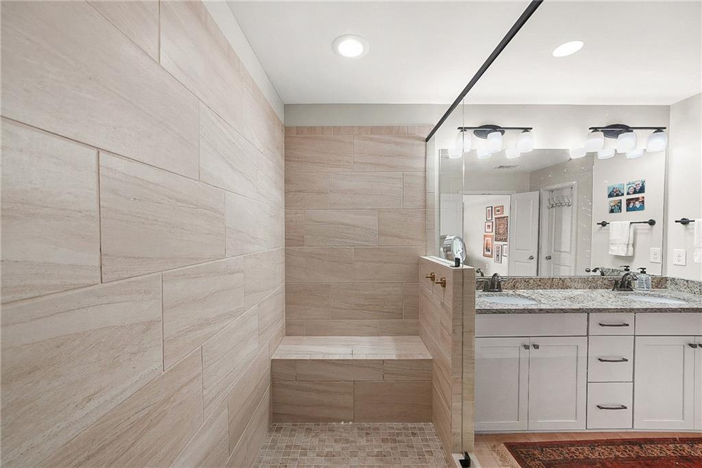 3715 Benton Lane Chamblee, GA 30341 - Photo 22 of 43 a bathroom with a granite countertop sink a toilet and shower